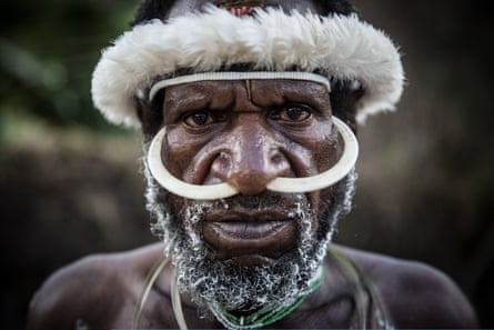 A Papuanese man poses at the Baliem Valley Cultural Festival in Wamena, Indonesia.