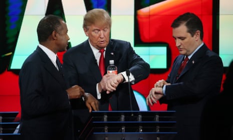 Republican presidential candidates Ben Carson, Donald Trump and U.S. Sen. Ted Cruz (R-TX) look at their watches during the CNN Republican presidential debate on December 15, 2015 in Las Vegas, Nevada, perhaps wondering when they will be asked about climate change.