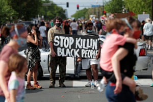 Protesters at the scene where Floyd was pinned down by a police officer