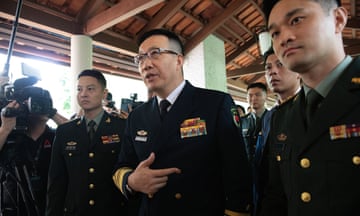 Dong Jun flanked by other members of China's armed forces