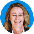woman smiling against blue background