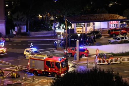 A firetruck and police cars in a closed off area