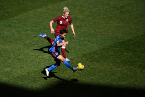Mina Tanaka #15 of Japan passes the ball as Millie Bright #6 of England defends.