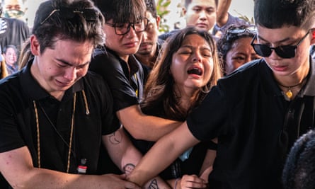 Family members grieve at the burial of Percy Mabasa in Manila in October.
