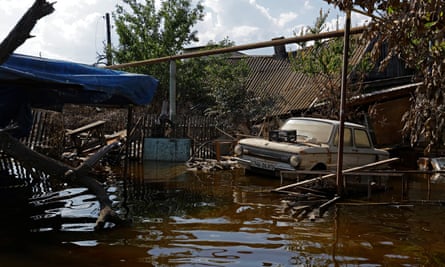 A view showing a Soviet-made Zaporozhye car on a street after the flood waters receded in Hula Pristan.