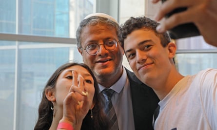 Two young supporters pose for a selfie with Itamar Ben-Gvir