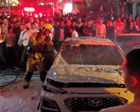 A firefighter works at the scene of an Iranian missile strike in Bnei Brak, Israel