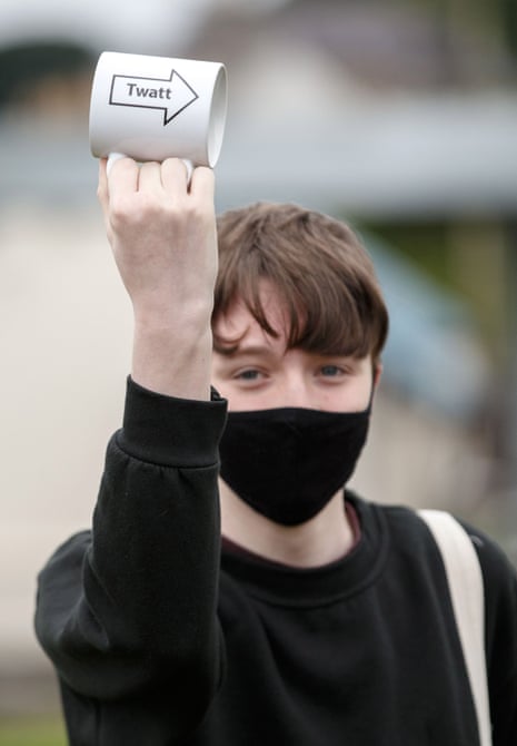 A protester holds up a mug with “Twatt” written on it (the name of a small town in Orkney), marking Boris Johnson’s visit.