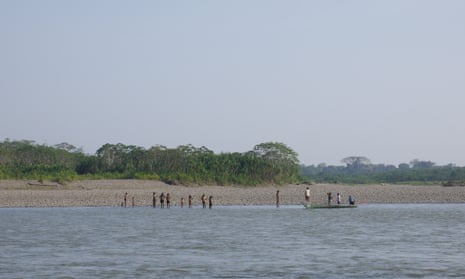 An uncontacted tribe in Peru on the shore of a river