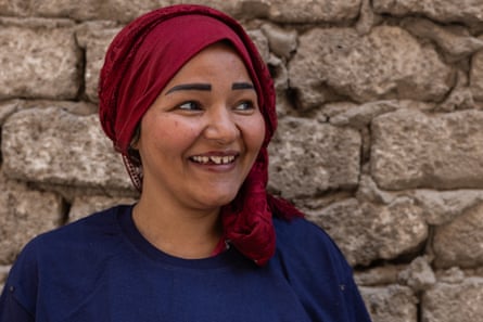 Portrait of a smiling woman wearing a red headscarf