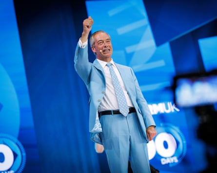 Nigel Farage, wearing a sky blue suit, gestures