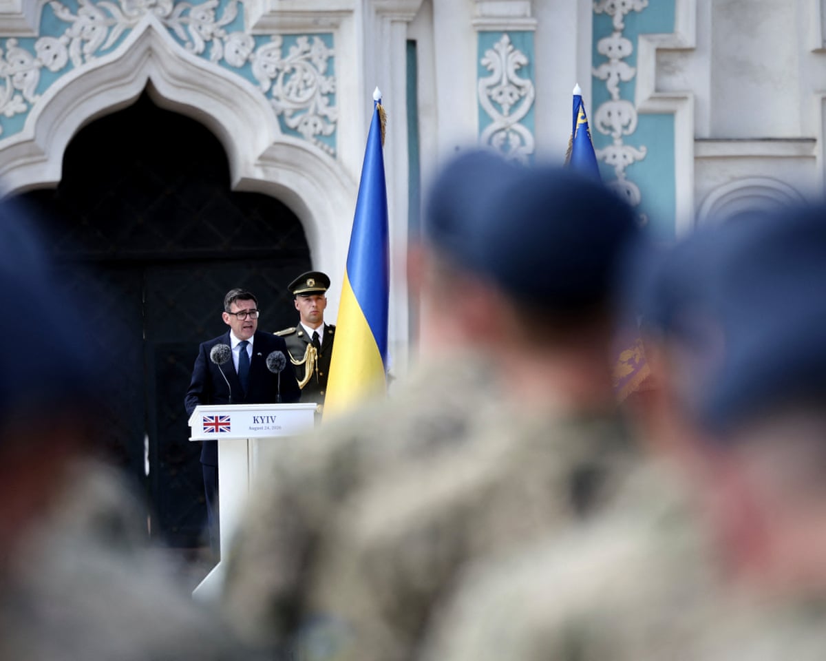 Britain's prime minister Andy Burnham (C) addresses National Guard of Ukraine and European leaders as he attends a commemorative ceremony marking Ukraine's 35th Independence Day outside St. Sofia cathedral in Kyiv.