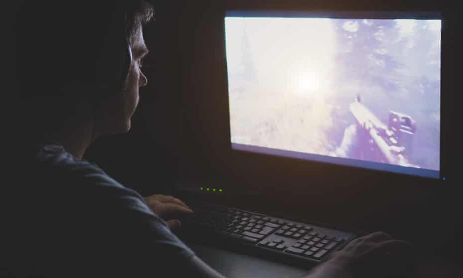man playing a shooter video game