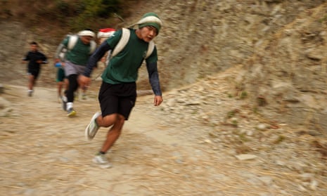 Potential recruits to the British Gurkhas reach the final stretch of the ‘doko run’: a5km uphill race, which they must complete in less than 46 minutes, while carrying a 2.5kg sack of sand.