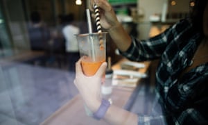 Vivian Ho testing different straws for boba tea.