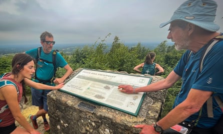 Tony Cartwright, the guide, and walkers pause at a viewpoint.