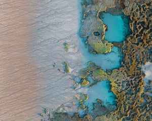 Aerial category runner-up ‘Tidal tones and textures’ show an aerial view of the tides of a blue ocean meeting a sandy beach