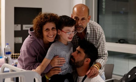 Ohad Munder, nine, meets with his family members after he returned to Israel.