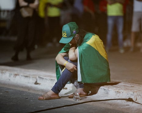 A despondent supporter of presidential candidate Flávio Bolsonaro