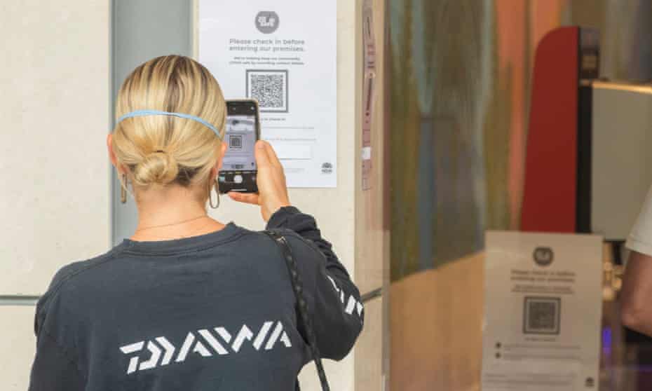 A shopper uses a QR code at a supermarket in Manly 