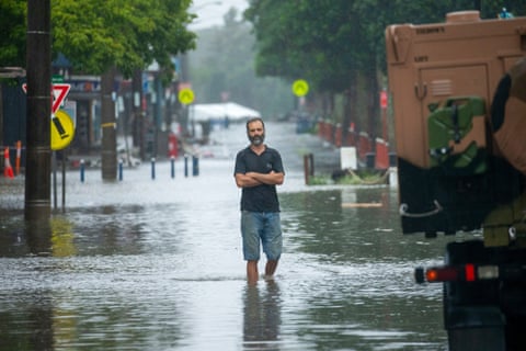 Man in flood water in Lismore