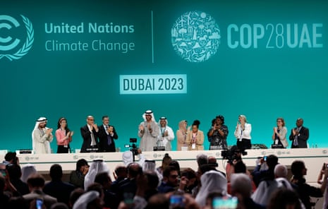 Cop28 attenders applaud after announcement of the consensus reached at the climate summit in Dubai on Wednesday.