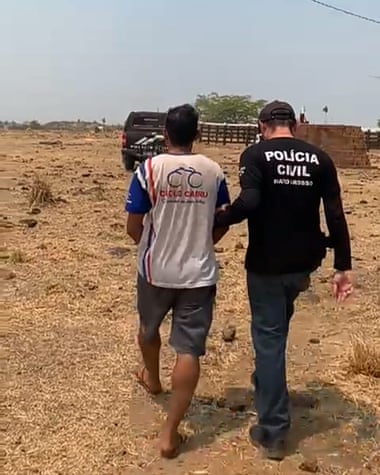 Police escort Rafael Silva de Oliveira, the Bolsonaro-supporting lumberjack who allegedly murdered a colleague last week after a row over politics.