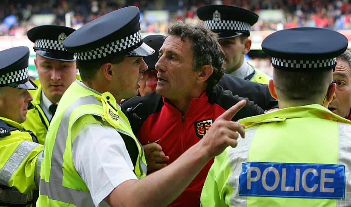 Toulouse’s coach Guy Noves argues with police officers after his side beat Stade Français 18-12 at Murrayfield