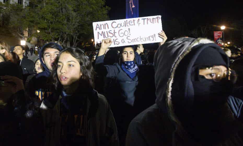 A University of California, Berkeley student joins protesters outside a speech by Ann Coulter in Berkley, California, on 20 November. 