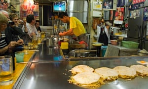 Okonomimura. Okonomiyaki (Japanese Pancake) being made at a fast food outlet.