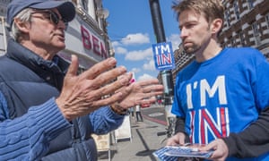 Two men, one wearing an 'I'm in' T-shirt