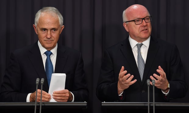  Malcolm Turnbull and George Brandis, who says allowing intelligence agencies to access encrypted communications without a warrant should be considered. Photograph: Lukas Coch/AAP  