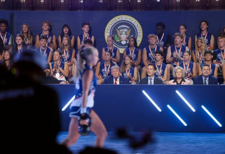 Trump watches a girl compete in the kettle bell portion of the Patriot Course during Tuesday’s final.