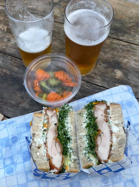 Breaded chicken, mayo and shredded leaves between two thick slices of white bread