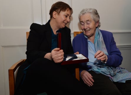 Anne Enright with her mother Cora in 2015. They are sitting on chairs, laughing