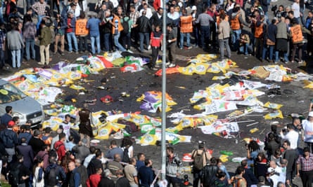 Victims lie on the street in Ankara as the scene of the explosion is cordoned off .