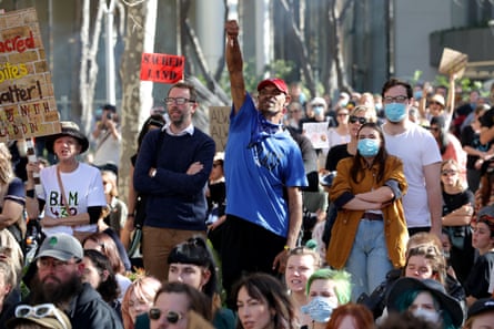 Protesters gather outside the Rio Tinto office in Perth on Tuesday.