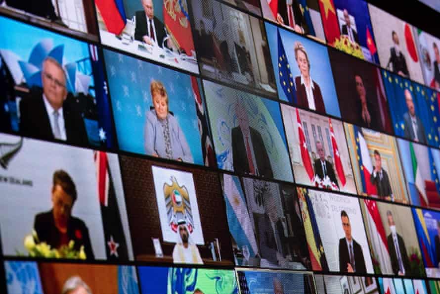 World leaders are seen on a screen at the White House during the virtual climate summit on 22 April.