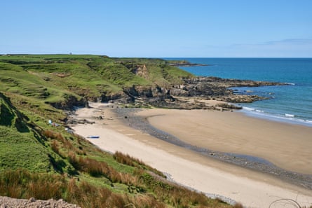 A view across Porth Towyn beach on the Llyn Peninsula from the Wales Coast Path looking towards Porth Ysglaig