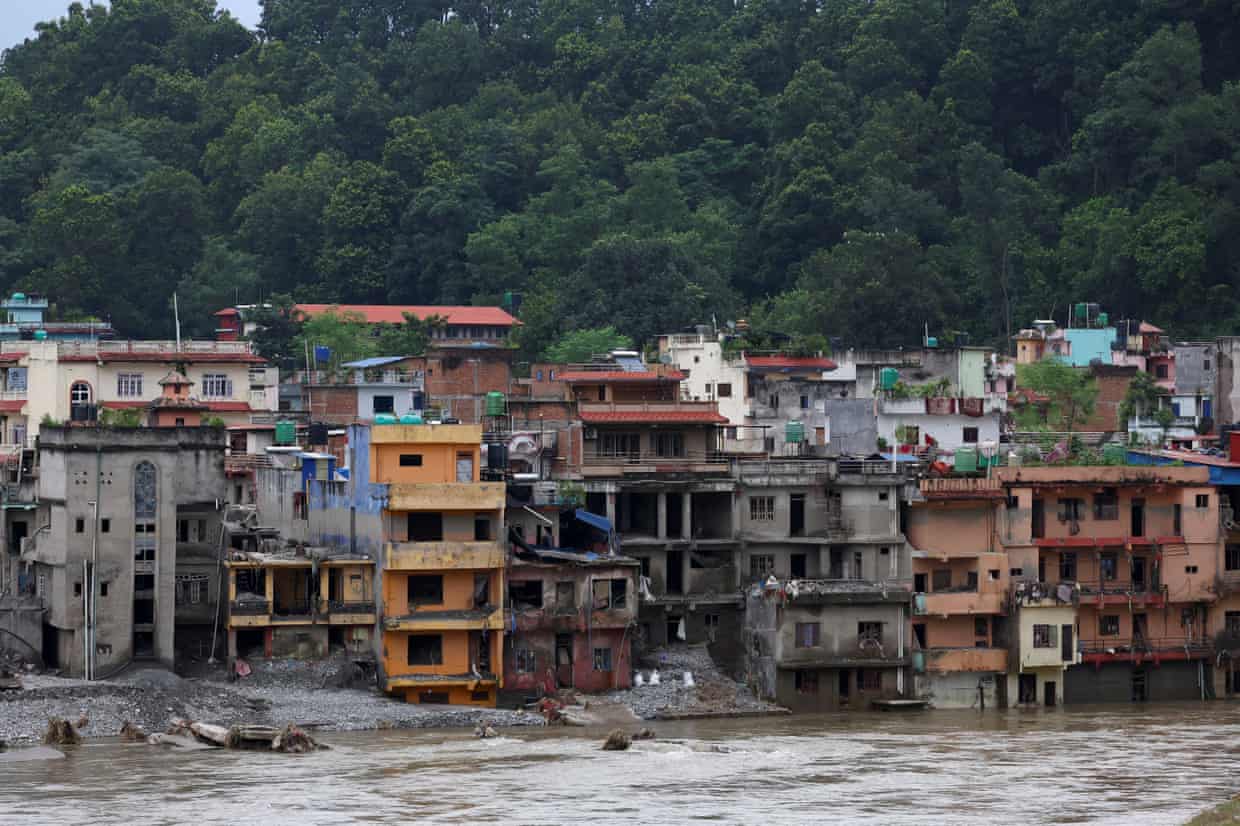 Damaged buildings on the banks of the Trishuli River