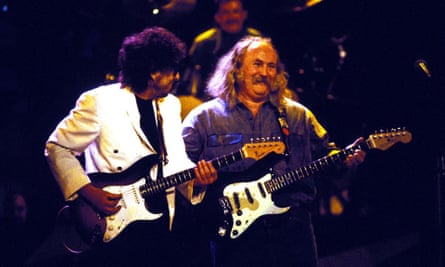Bob Dylan and David Crosby playing electric guitar on stage
