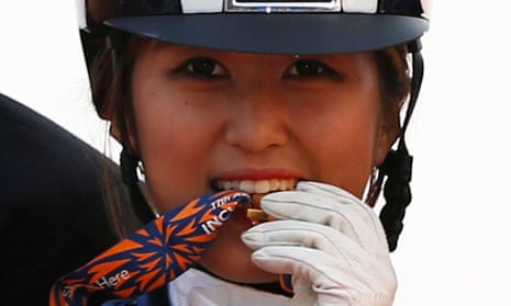 Chung Yoo-ra poses after winning the equestrian Dressage Team competition during the 17th Asian Games in Incheon in 2014. 