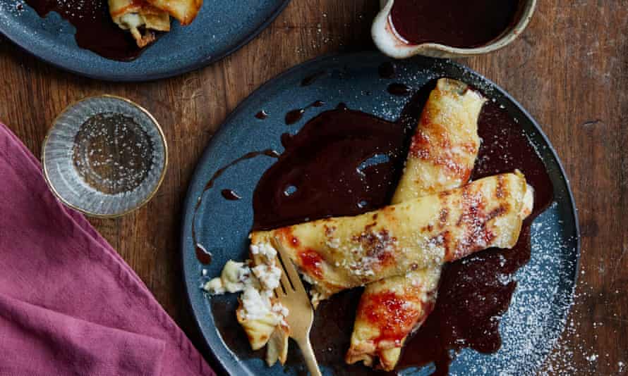 Alex Jackson's Baked Ricotta-Stuffed Pancakes with Sweet and Sour Cherry Sauce brings sweetness and tanginess in a mouth-watering bite.