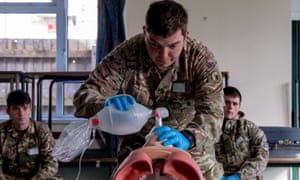 A Royal Signals soldier practices skills acquired during training, as the British Army trains 60 soldiers to prepare to support the Welsh Ambulance Service NHS Trust (WAST) in the battle against coronavirus, in Wales, Britain 6 April, 2020.