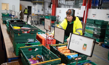 A worker at a foodbank. Austerity, the pandemic and the cost of living crisis means working conditions for social workers have deteriorated.