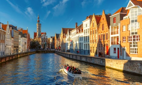 Tourist boat on Bruges canal.