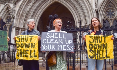 Environmentalists outside the Royal Courts of Justice in London protesting against Shell oil spills.
