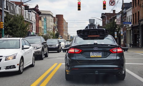 A self-driving Uber car drives in Pittsburgh. The vehicles must be equipped with cybersecurity gear, according to a House measure.