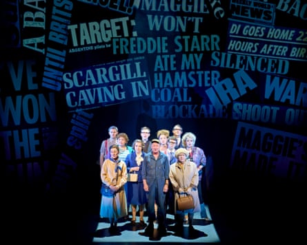 The cast of Pride on stage at the National Theatre, with newspaper headlines from the era in the background