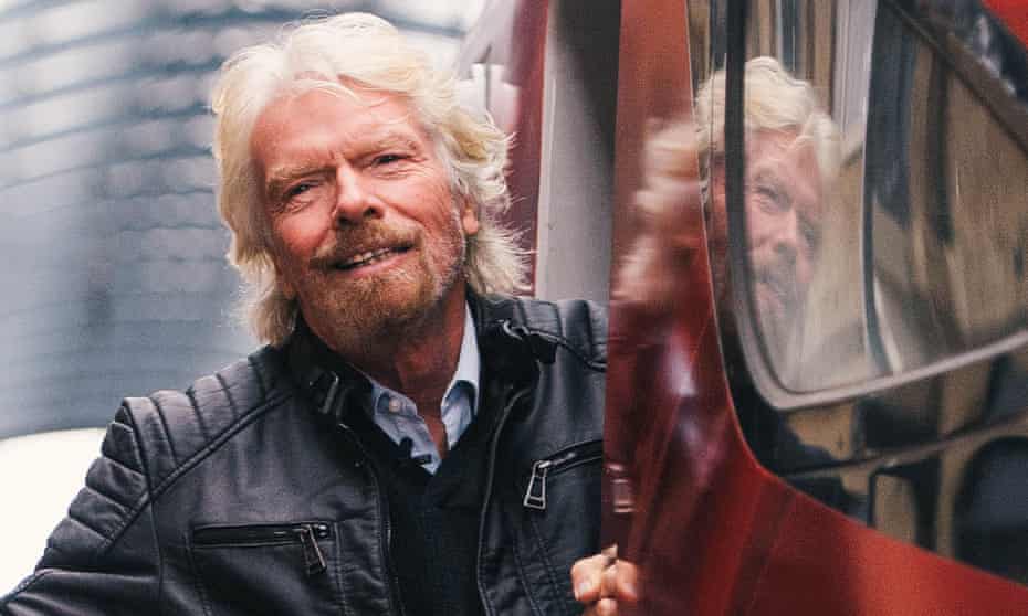 Richard Branson in the doorway of a Virgin train